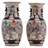 A pair of Chinese polychrome stoneware vases, overall decorated with warriors, marked, about 1900, H