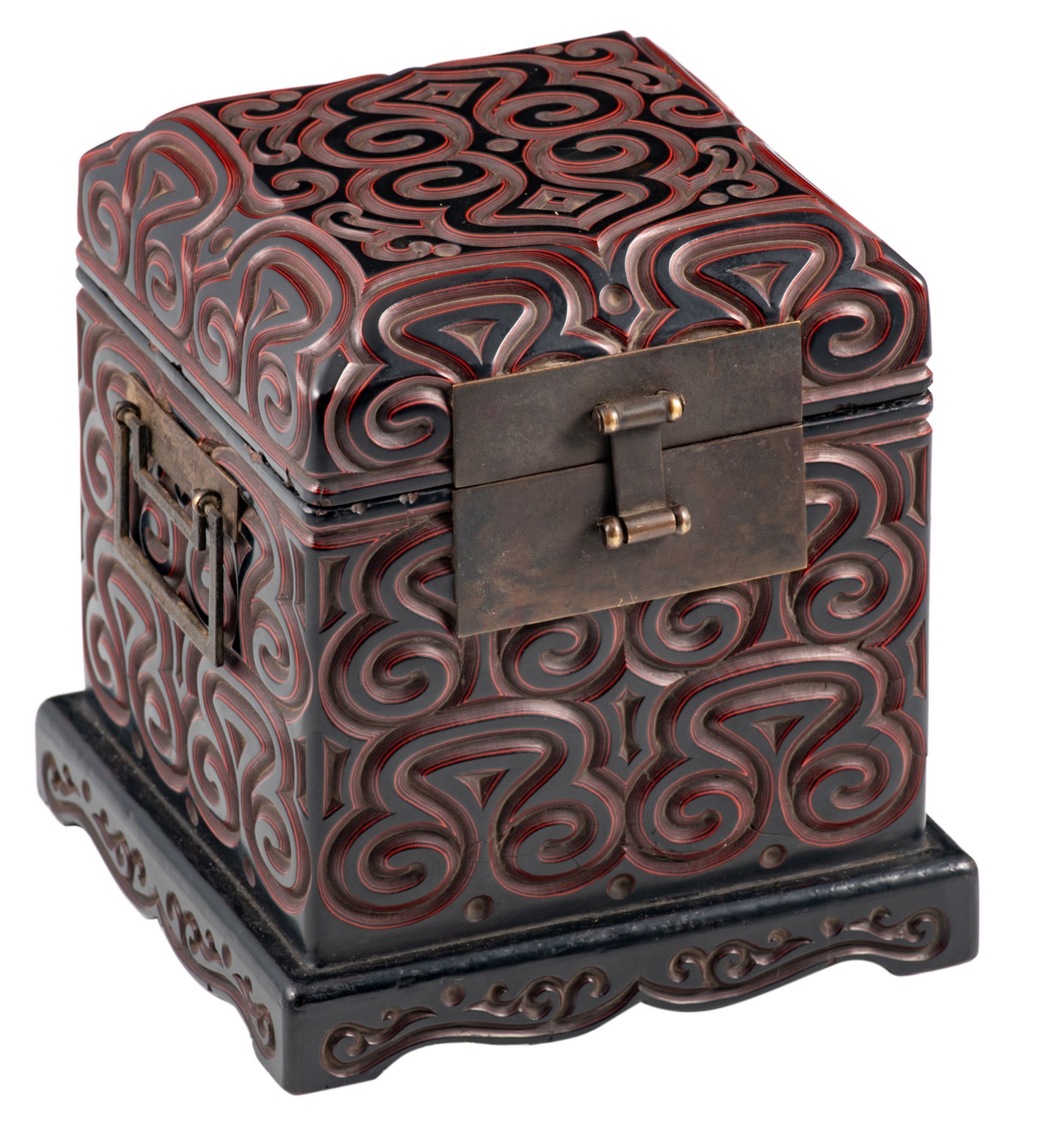 A rare Chinese carved black and cinnabar lacquer seal chest, decorated with pommels, with