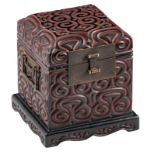 A rare Chinese carved black and cinnabar lacquer seal chest, decorated with pommels, with