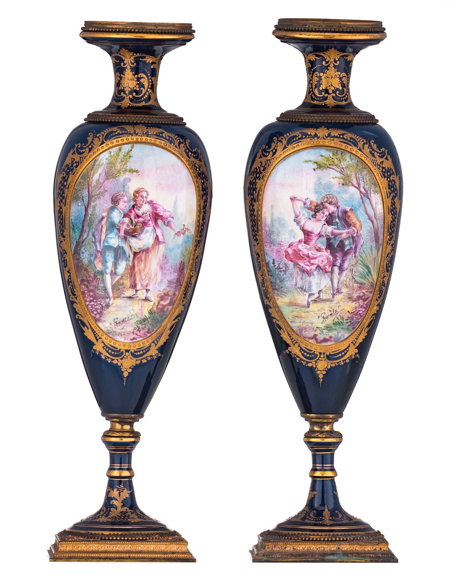 A pair of bleu royal and gilt enamel Sèvres manner bases, the four roundels decorated with gallant