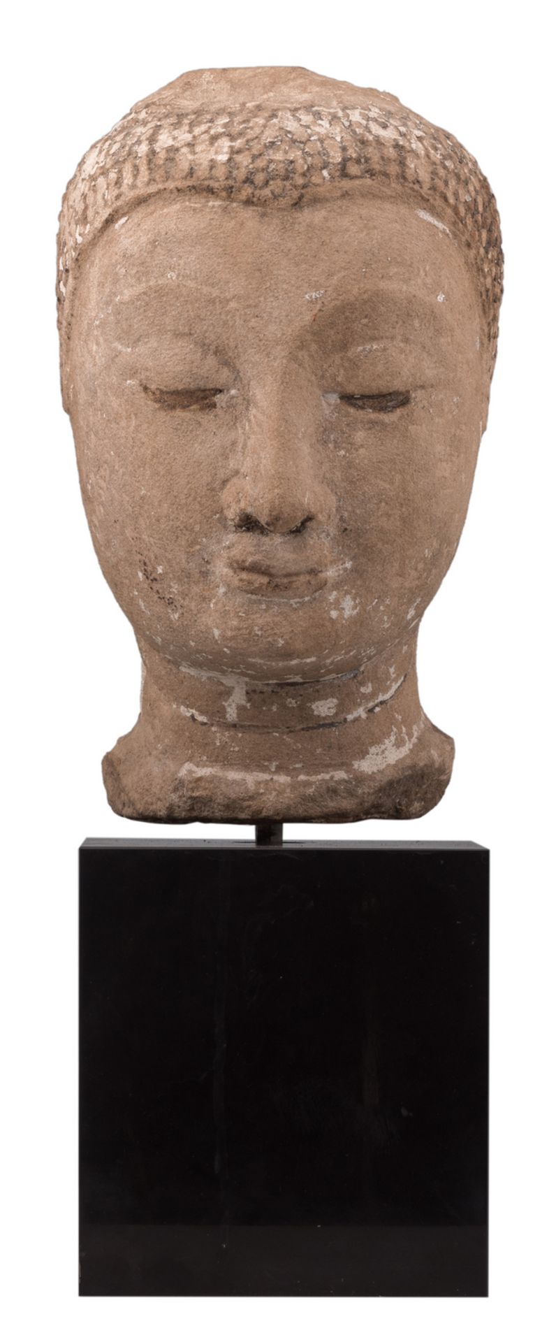 A Southeast Asian sandstone head of Buddha with traces of polychromy, probably Thailand, possibly