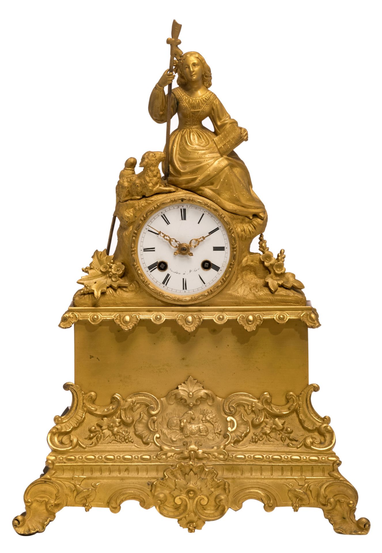 A second half of the 19thC gilt bronze mantel clock with on top a bucolic scene, the dial