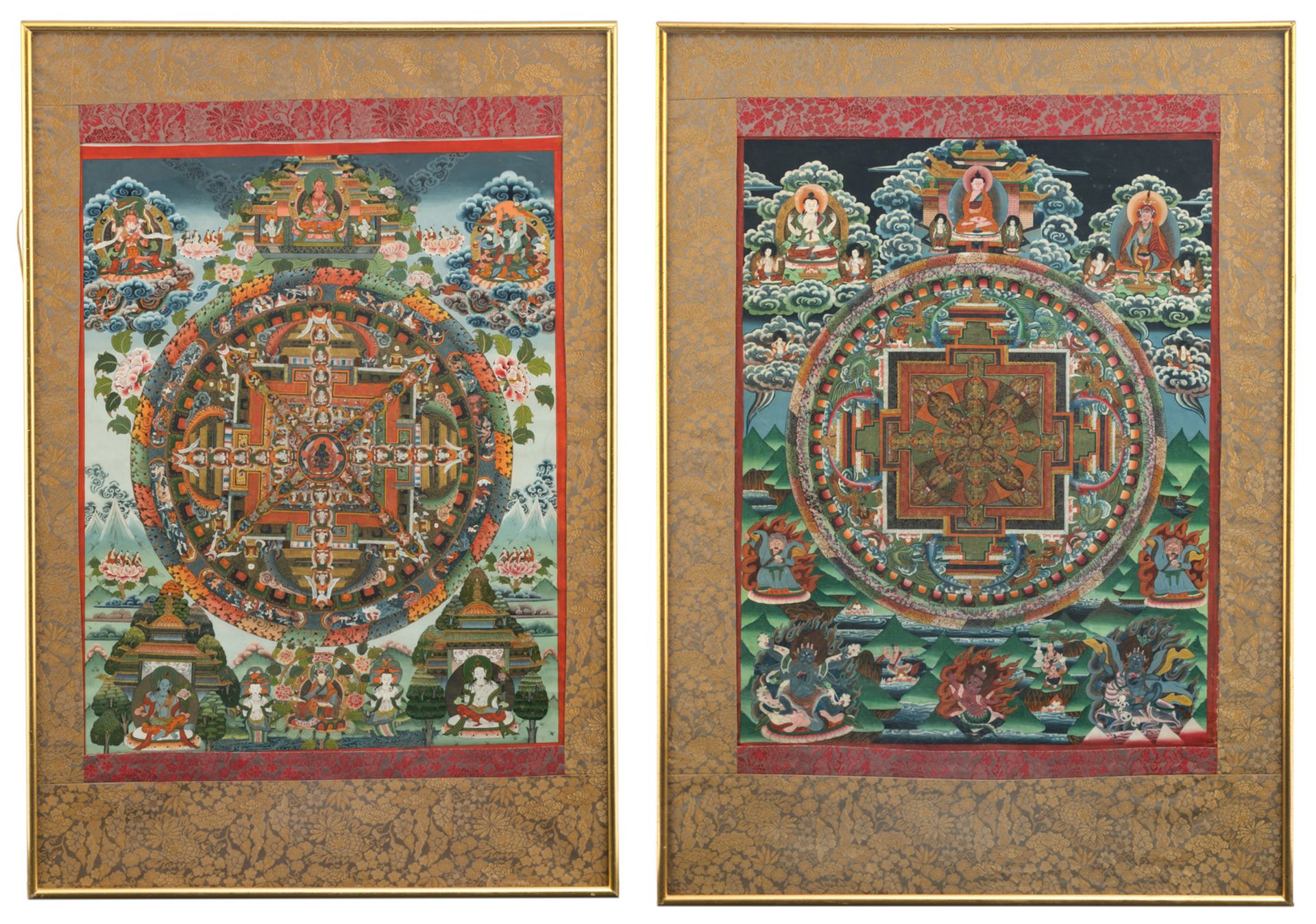 Two Tibetan tangkas, with floral decorated textile mounts, framed, 51 x 64 - 52 x 67,5 cm