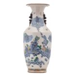 A Chinese polychrome stoneware vase, overall decorated with Immortals, savants and their servants,