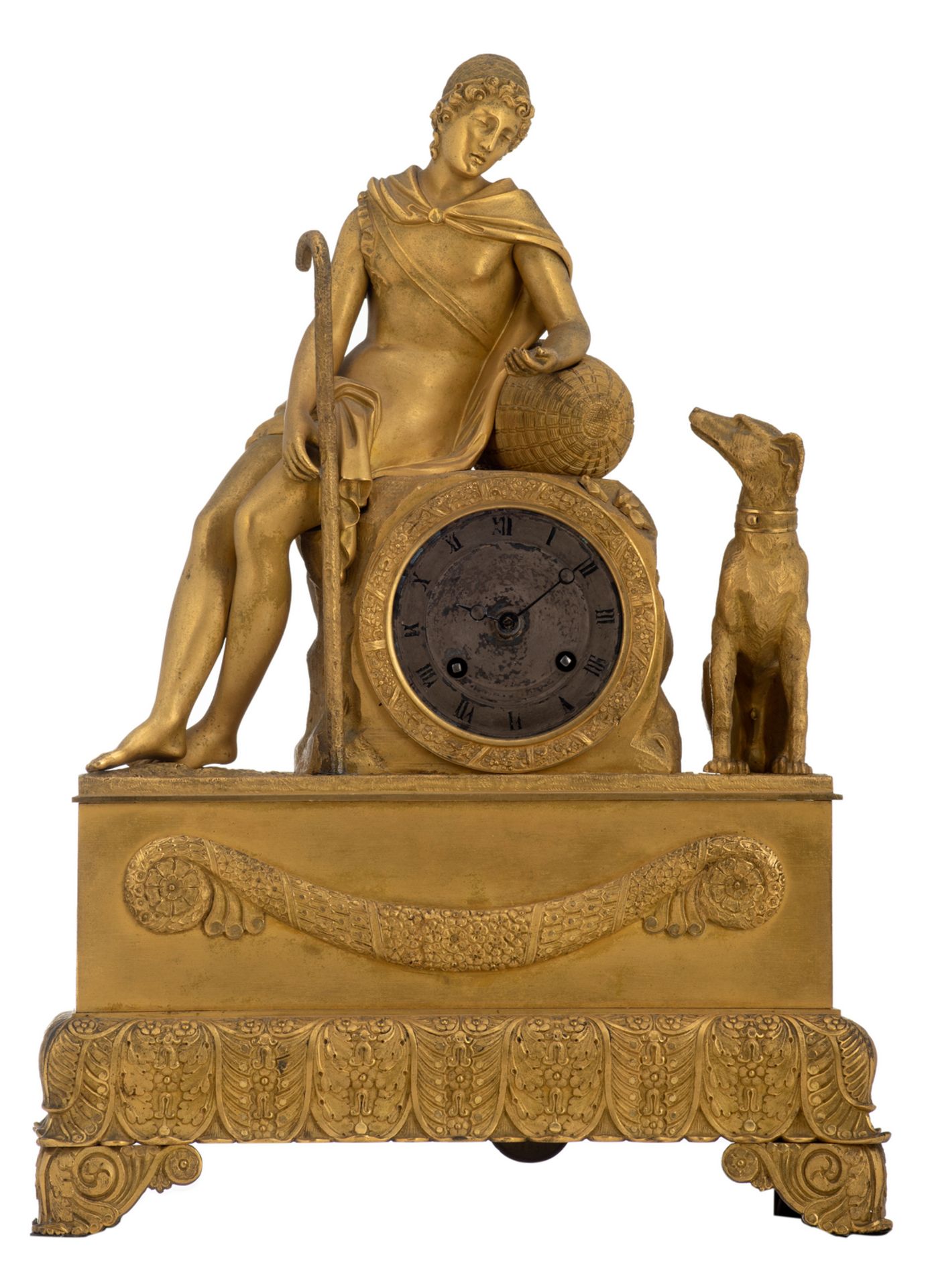 A gilt bronze mantel clock with on top a bucolic scene, about 1840, H 40 cm