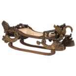 A rare 19thC stained and gilt walnut sledge, richly sculpted with dolphins and an eagle, Italian