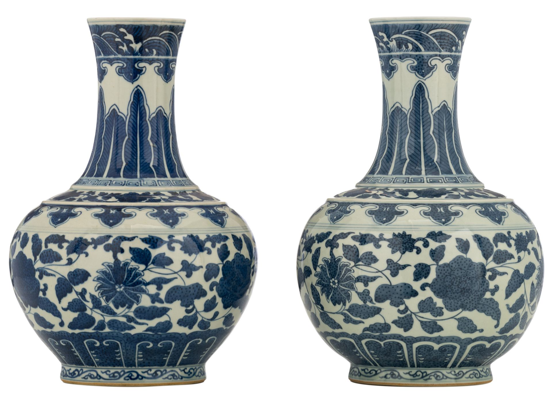 Two Chinese blue and white floral decorated bottle vases, with a Tongzhi mark, H 34 cm