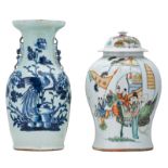 A Chinese polychrome vase and cover, decorated with an animated garden scene and a calligraphic