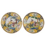 Two Chinese pink and blue back Canton enamel dishes decorated with a European subject, ø 21,5 cm