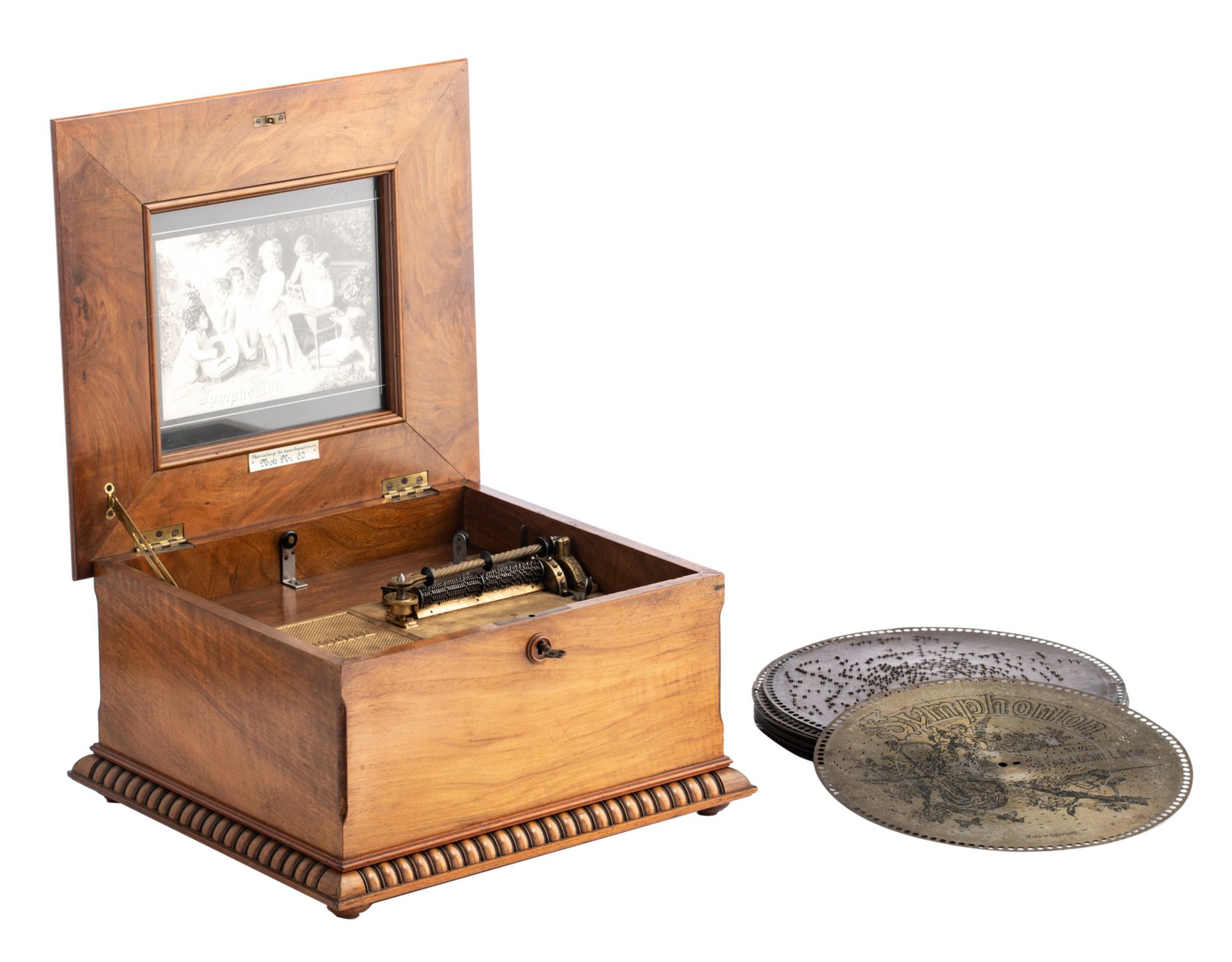 A walnut and marquetry veneered Symphonion music box with twelve matching discs, H 25 - W 42 - D