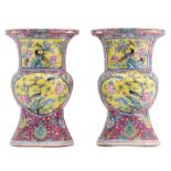 A pair of Chinese pink ground flower decorated beaker vases, the roundels yellow and green ground