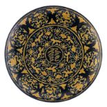 A large Chinese deep blue ground and yellow glazed plate, decorated with dragons amid clouds and