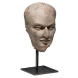 A terracotta portrait of a man, Middle East, probably Gandara, 3 - 4 AD, on an iron mount, (ex