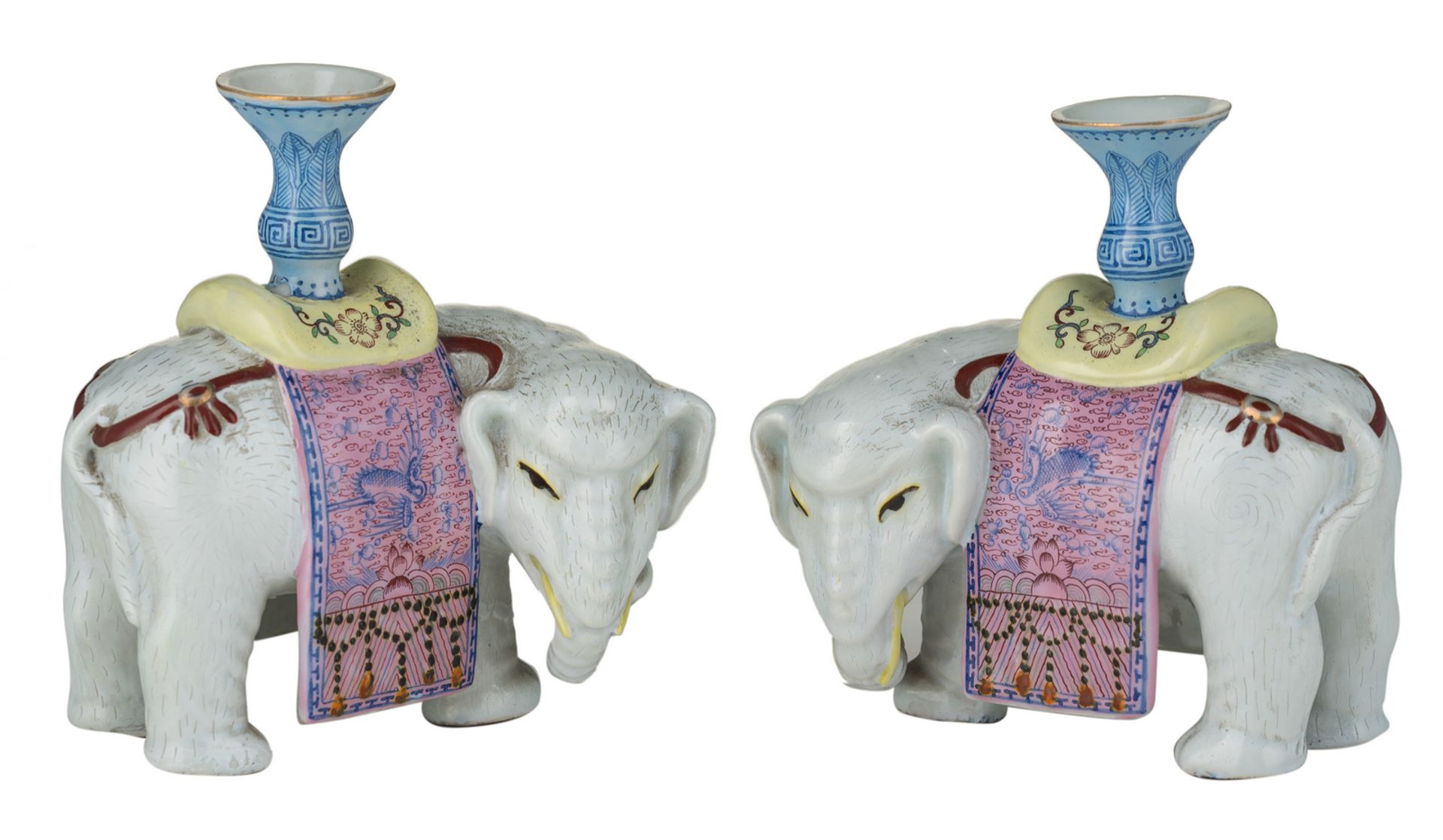 A pair of Chinese polychrome decorated elephant shaped stick holders, H 13 cm