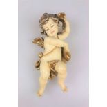 Putto, Holz, Barockstil, 2. Hälfte 20. Jh., vollplastisch, polychrom bemalt, H. ca. 27,5 cm.