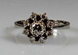 Ring, WG 585, 1 Brillant ca. 0.25 ct., 8 Besatz-Brillanten, 3 g, RM 18 20.00 % buyer's premium on