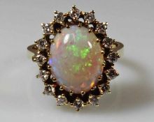 Ring, GG 585, 1 ovaler Vollopal-Cabochon, 16 Besatz-Brillanten zus. ca. 0.48 ct., 7 g, RM 17.5 20.00