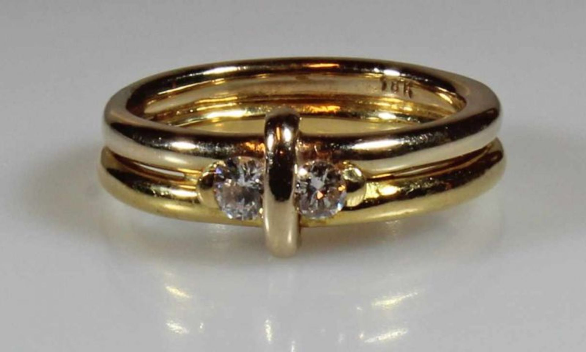 Ring, GG 750, 2 Brillanten zus. ca. 0.15 ct., 8 g, RM 17.5 20.00 % buyer's premium on the hammer
