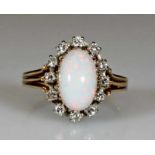 Ring, WG/RG/GG 750, 1 Opal-Cabochon, 12 Brillanten zus. ca. 0.32 ct., 5 g, RM 17.5 21.01 % buyer's