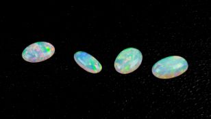 Konvolut Opale im Cabochonschliff Vollopal, Farbe crystal, 6-tlg., Australien, 2 Steine zusammen 2,