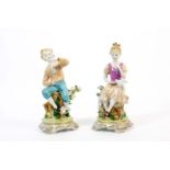Paar Kinderfiguren Meissen-Imitationsmarke, 20. Jh., Porzellan, weiß, farbig und gold staffiert,