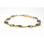 Armband Italien, 750 Gelbgold, 9 Iolite in Brillenfassung, Länge 18 cm, Gewicht ca. 5,7 g