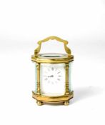 Ovale Reiseuhr Mitte 19. Jh., Messing, 5-seitig verglast, Höhe 10,6 cm, Schweizer Ankergang, läuft