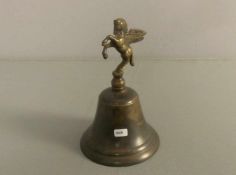 GLOCKE MIT PEGASUSBEKRÖNUNG / bell, Bronze, 1. Hälfte 20. Jh.; H. 18,5 cm; D. 12 cm.