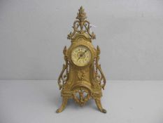 TISCHUHR / KAMINUHR / table clock, 1. H. 20. Jh., ungemarkt, bronzierter Metallguss. Durchbrochen