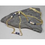 CHRISTIAN DIOR - KETTE, vergoldeter Modeschmuck mit blauen Steinen, imit. Perlen und weißen Steinen,