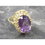 RING, (Gr. 57/58) besetzt mit ovalem, geschl. Amethysten in durchbrochener 585er Gelbgoldfassung (