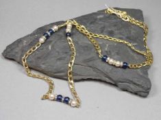 CHRISTIAN DIOR - KETTE, vergoldeter Modeschmuck mit blauen Steinen, imit. Perlen und weißen Steinen,