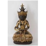 GUANYIN SITZEND, Statuette,vergoldet, mit Stoff und Glas, Ostasien 20. Jahrhundert. Teils goldfarbig