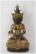 GUANYIN SITZEND, Statuette,vergoldet, mit Stoff und Glas, Ostasien 20. Jahrhundert. Teils goldfarbig