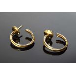 Paar GG 750 Cartier Creolen, sign./num. "NR 77763 Cartier", 3,7g Pair of YG 750 Cartier hoops,