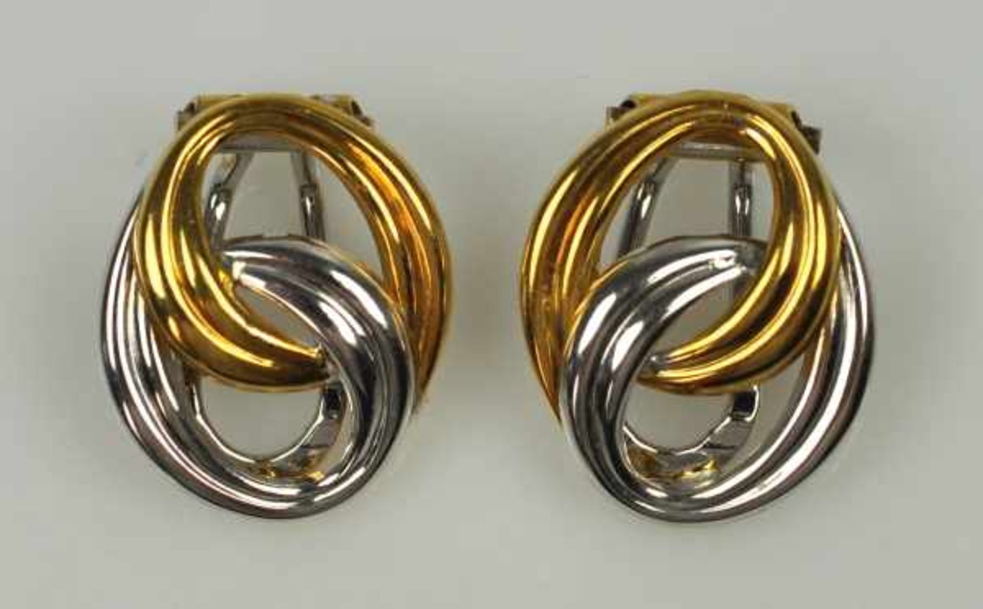 PAAR OHRCLIPS oval, aus polierten Gelb- und Weißgoldbändern, Gold 18ct, Marke "CB", Carl Bucherer