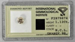 DIAMANT 1,11ct, Fancy-Diamond in Orange-Brauner Farbe, eingeschweißt mit Beschreibung,