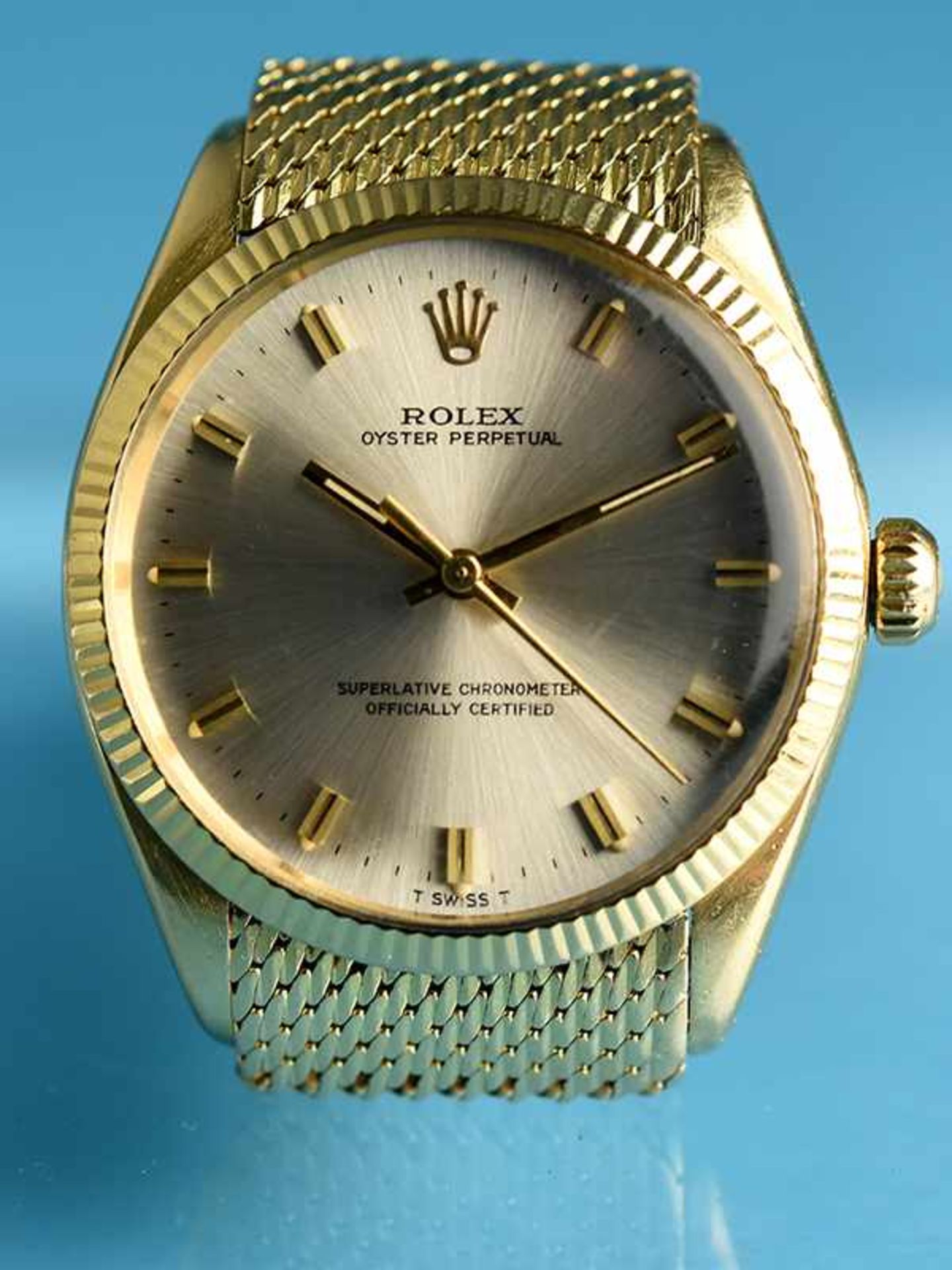 Herrenarmbanduhr "Oyster Perpetual", mit goldenem Armband und originaler Faltschließe von Rolex,