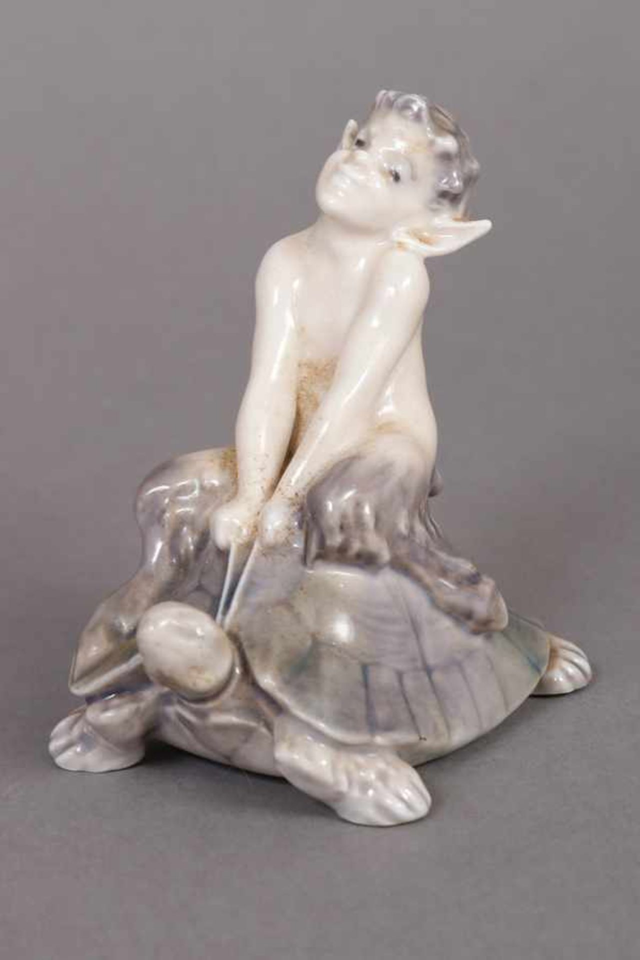 ROYAL COPENHAGEN Porzellanfigur ¨Faun auf Schildkröte reitend¨ 20. Jhdt., Entwurf Christian Ludvig