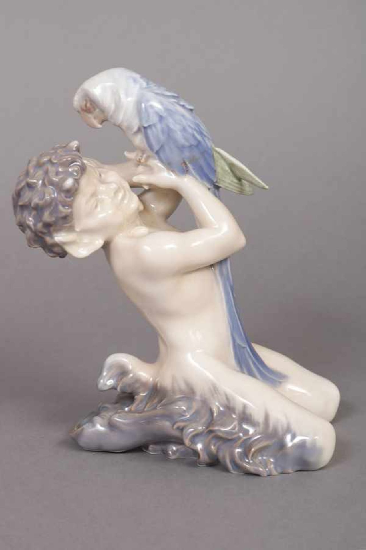 ROYAL COPENHAGEN Porzellanfigur ¨Faun mit Papagei¨ 20. Jhdt., Entwurf Christian Ludvig Thomsen,