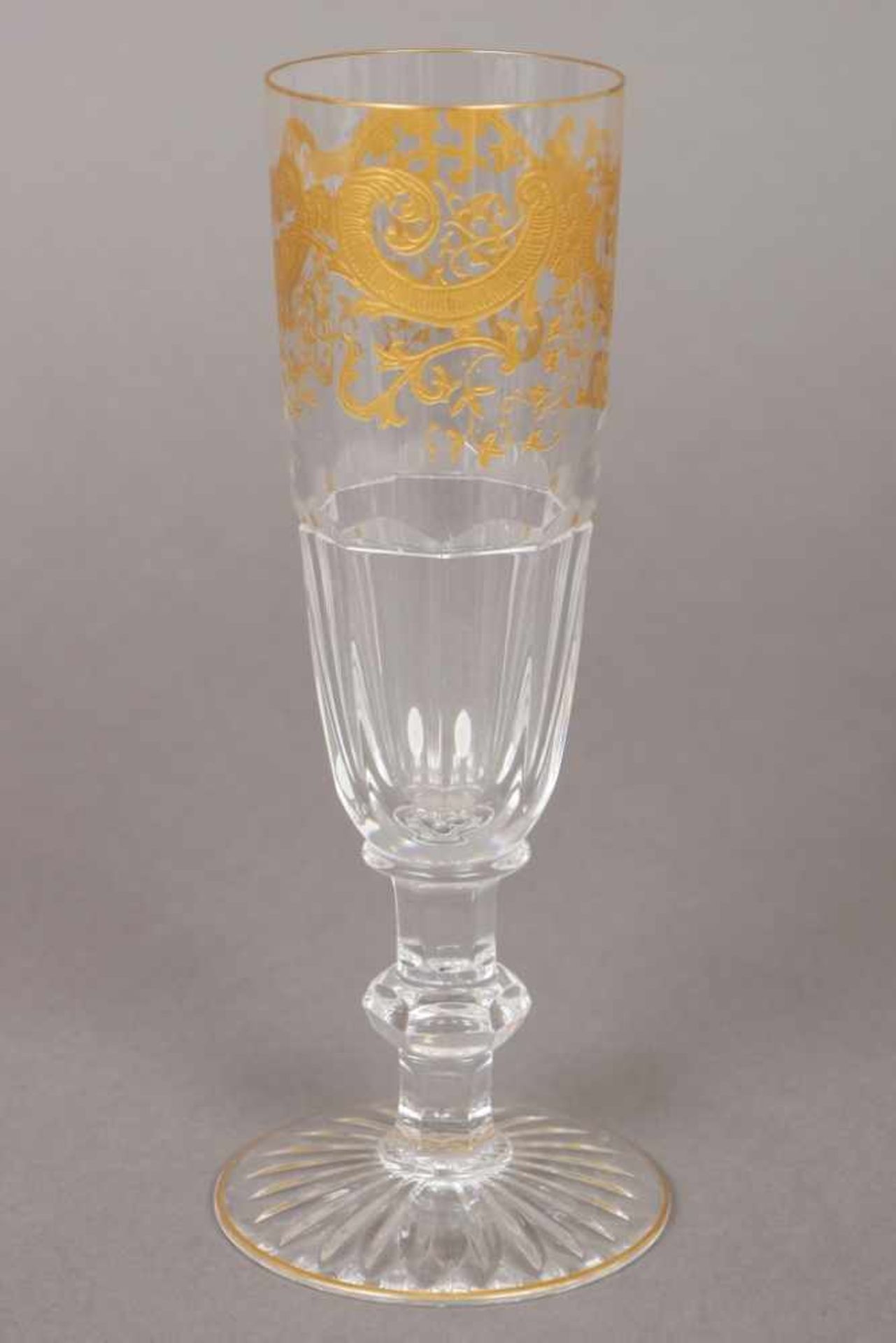 ST. LOUIS Sektglas ¨Rocaille¨-Dekor (goldstaffiert), facettierte Kuppa, Stand mit Sternschliff, H