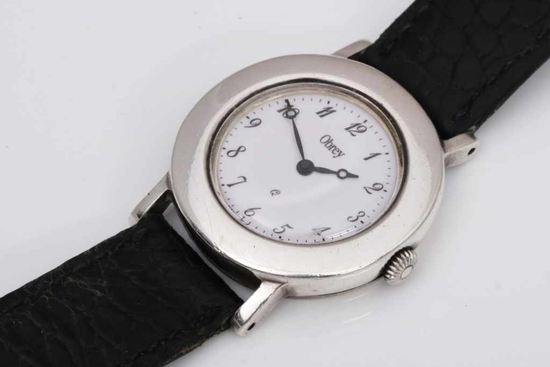 OBREY (Paris) Armbanduhr ¨Saint Germain¨ rundes Silbergehäuse (D 3cm) mit großen Anschlägen,