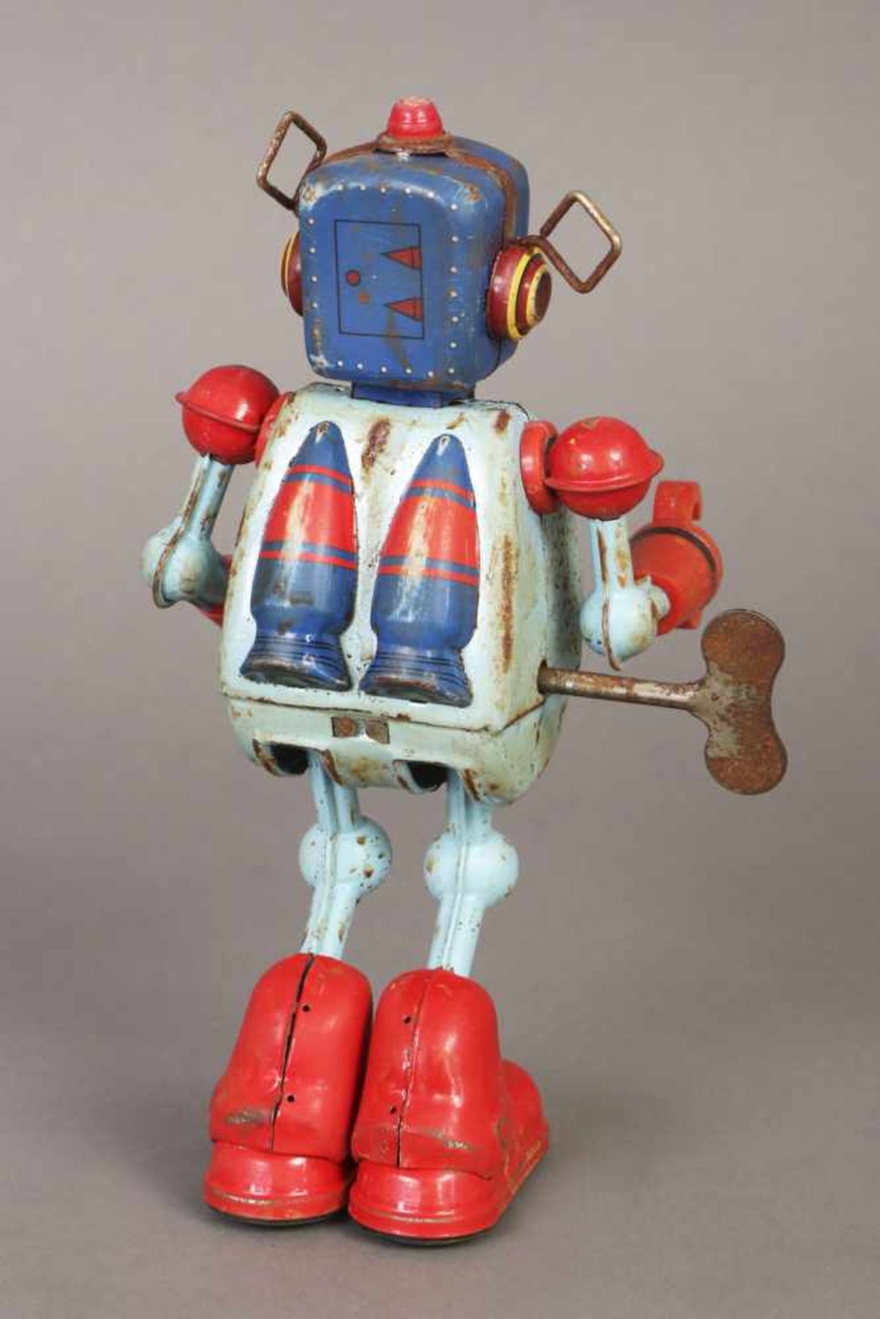 Blechspielzeug ¨Roboter¨farbig staffiertes Metall und roter Kunststoff, Federwerk mit - Bild 2 aus 2