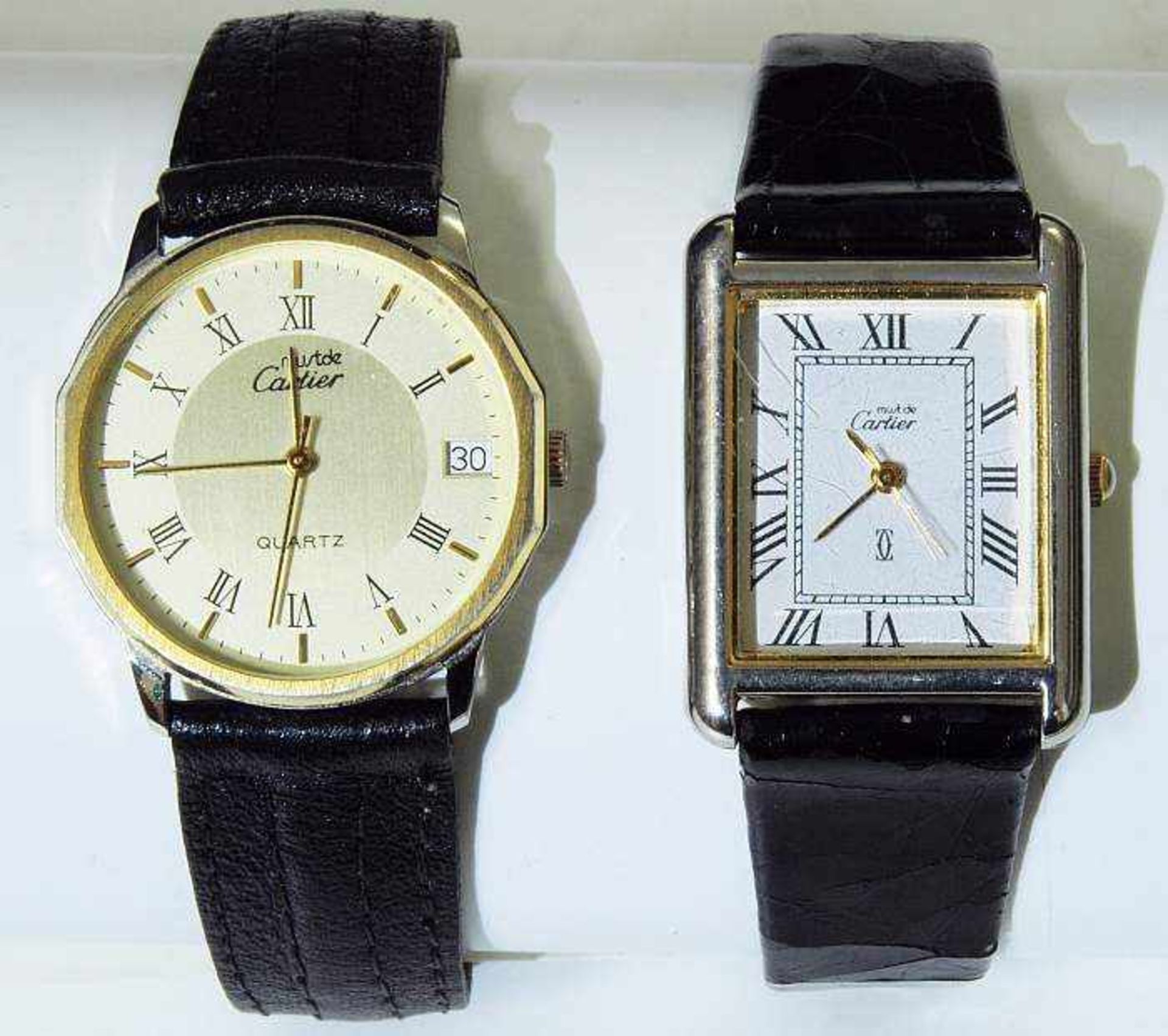 Zwei CARTIER Armbanduhren.Zwei CARTIER Armbanduhren. 1) Armbanduhr mit rechteckigem Stahlgehäuse