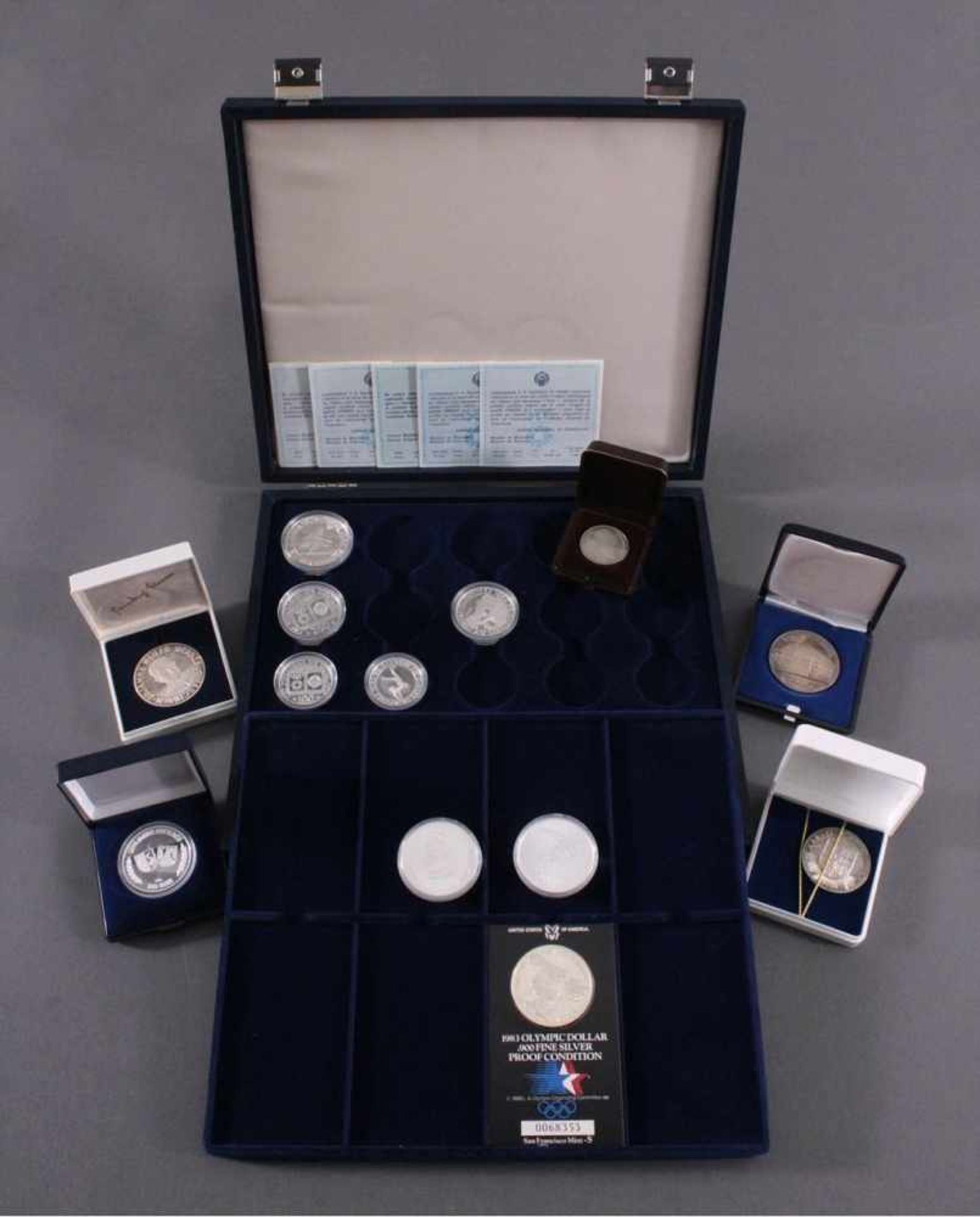 Sammlung Münzen und Medaillen5 Olympiamünzen USA mit Münzschatulle.2x 5 Canada Dollar in
