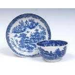 A Worcester Bandstand pattern tea bowl and saucer, printed and washed in blue with pagodas, trees,