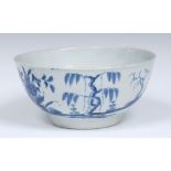 A Worcester Landslip pattern slop bowl, painted with a house on a slope, trees and flowering bush,