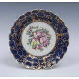 A Worcester shaped circular plate, painted in the atelier of James Giles,