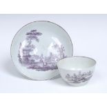 A Worcester tea bowl and saucer, printed in purple after Robert Hancock, with The Signal Tower,