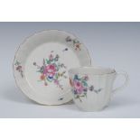 A Worcester Warmestry fluted cup and saucer, delicately painted with flower sprays and sprigs,